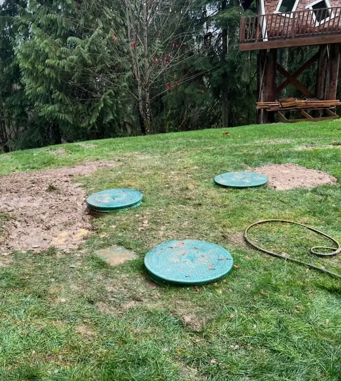 Technician performing a septic system inspection